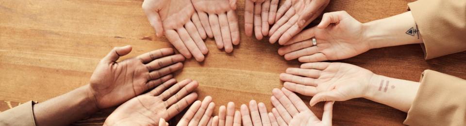 Hands on a table palms upwards